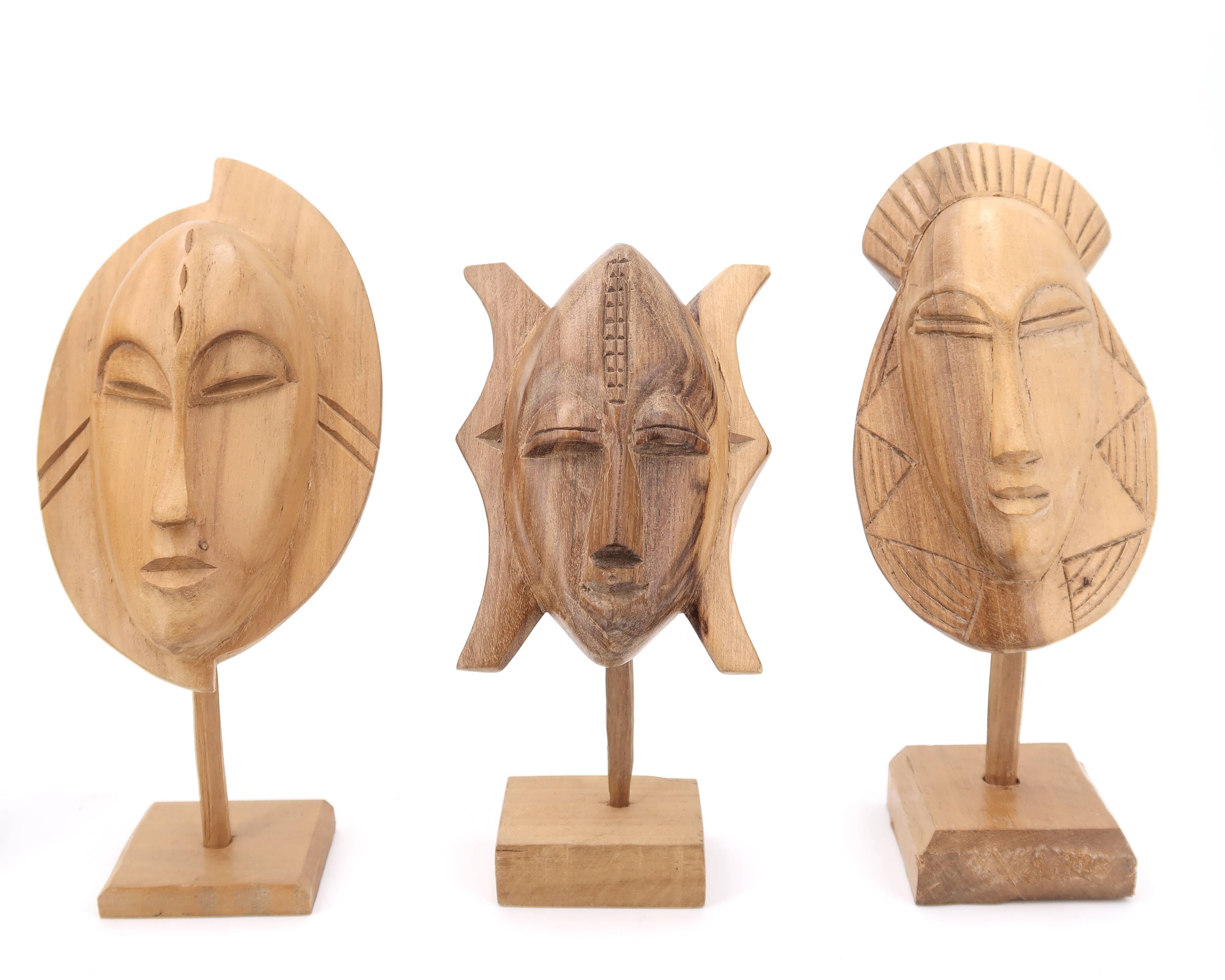 Six African masks with wooden bases, 1970s