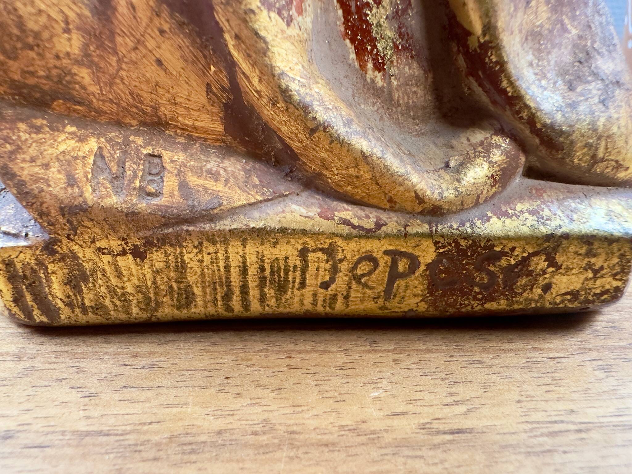 Statue of the Virgin holding the Child Jesus in polychrome terracotta.