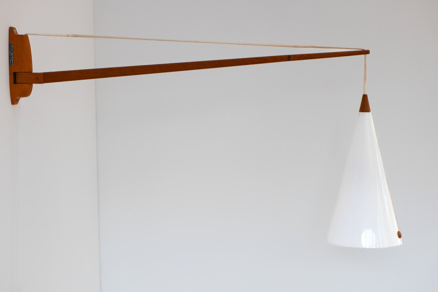 Mid-century Swedish wall lamp in teak by Uno and Östen Kristiansson for Luxus, 1960s