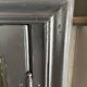 Aged patinated black display cabinet