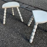 Duo of milking stools with turned legs.
