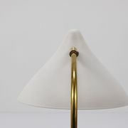 White brass desk or table lamp in the Louis Kalff style from the 1950s.