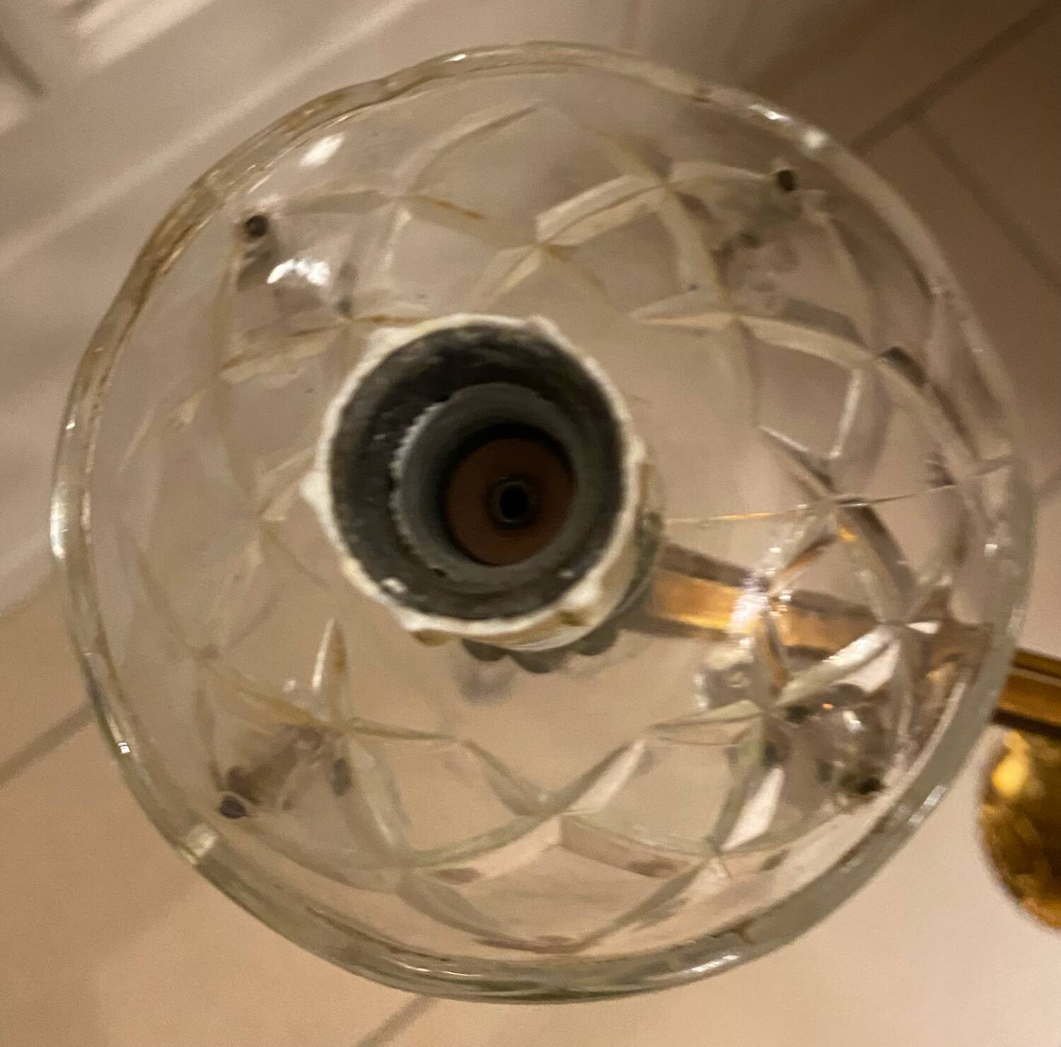 Golden brass chandelier and glass