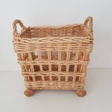Vintage wicker basket on wheels - children's toy trolley