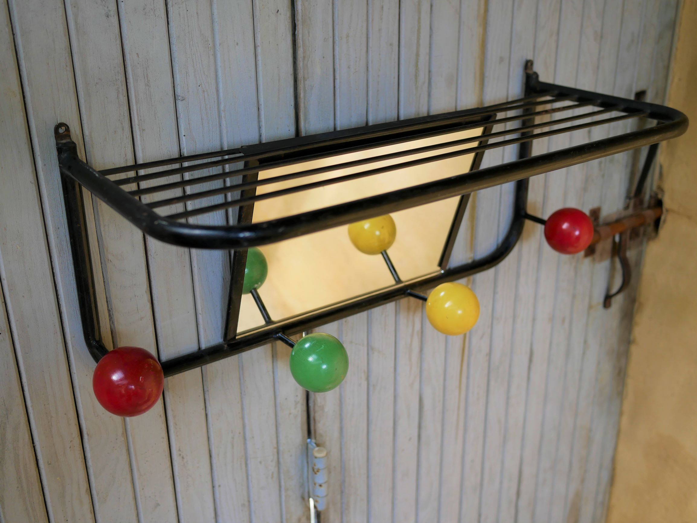 Vintage wall coat holder with 4 coloured balls, mirror and shelf