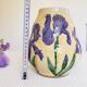 Hand-painted decorative vase with blue/purple irises.