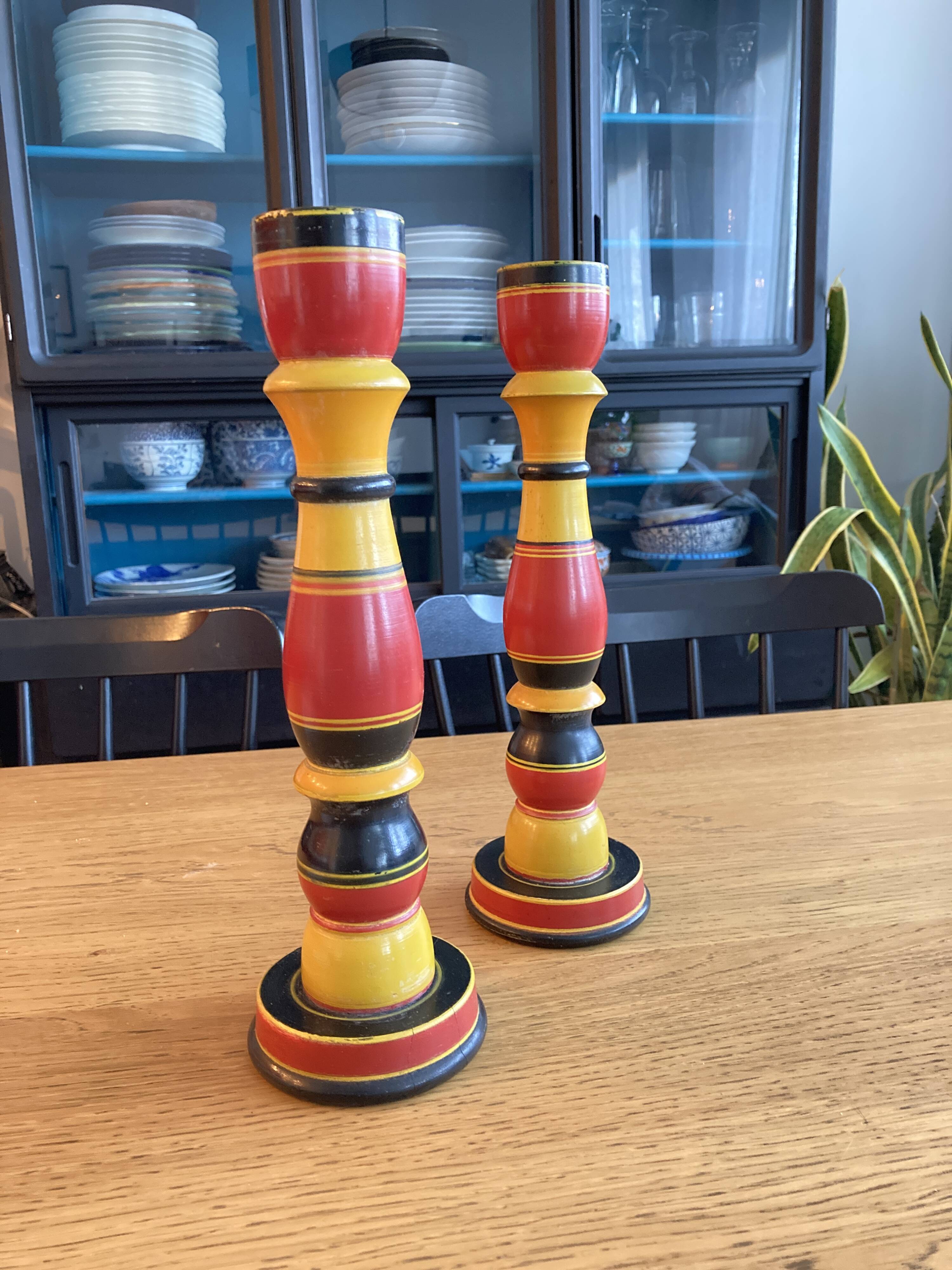 Polychrome turned wooden candlesticks