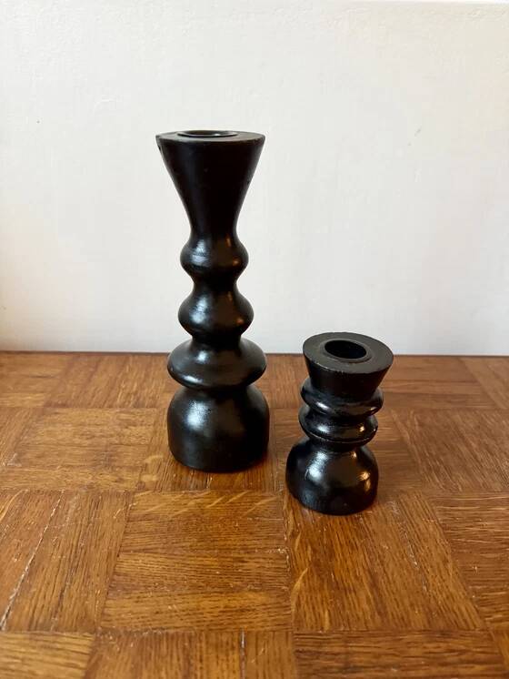 Pair of black turned wood candlesticks