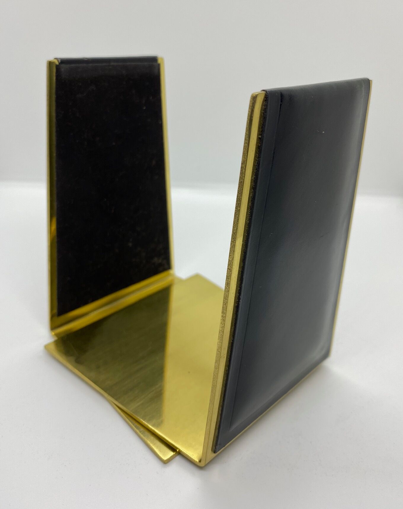 Vintage bookends, black leather and brass
