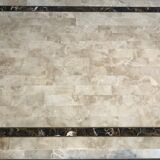 Coffee table made of marble plates with inlay of a brass net. French Work