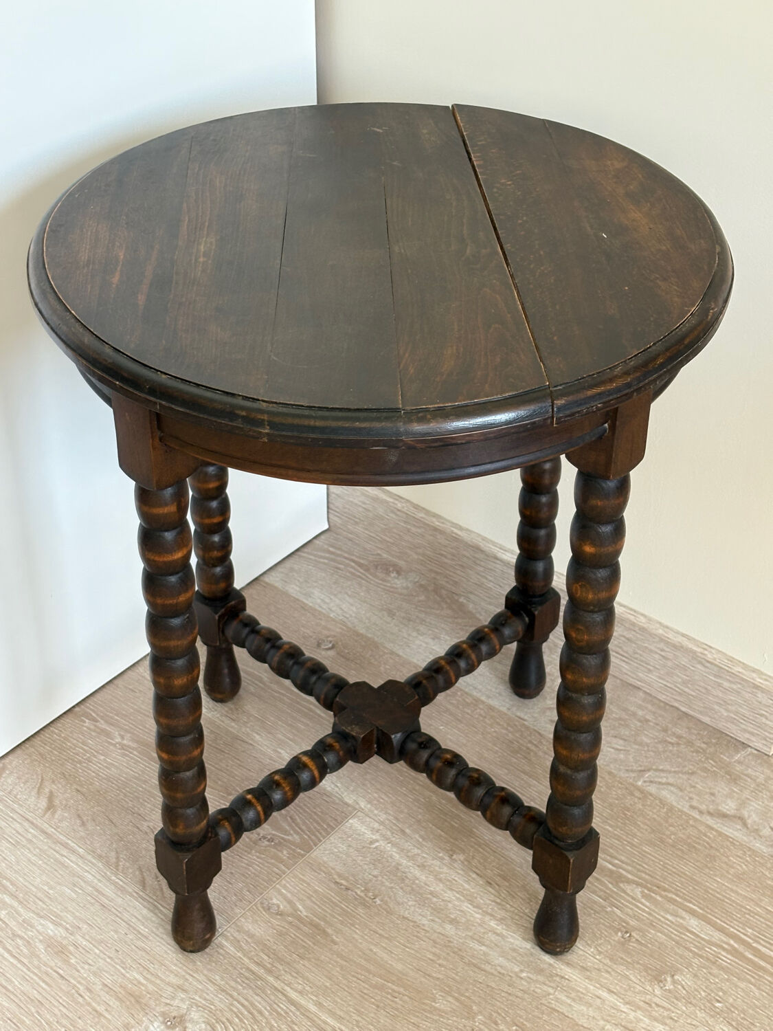 Antique turned wooden side table with authentic charm.