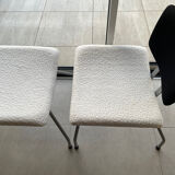Armchair and footrest in boucle wool.