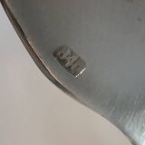 Silver plated metal service: 12 soup spoons, 12 forks and ladle.