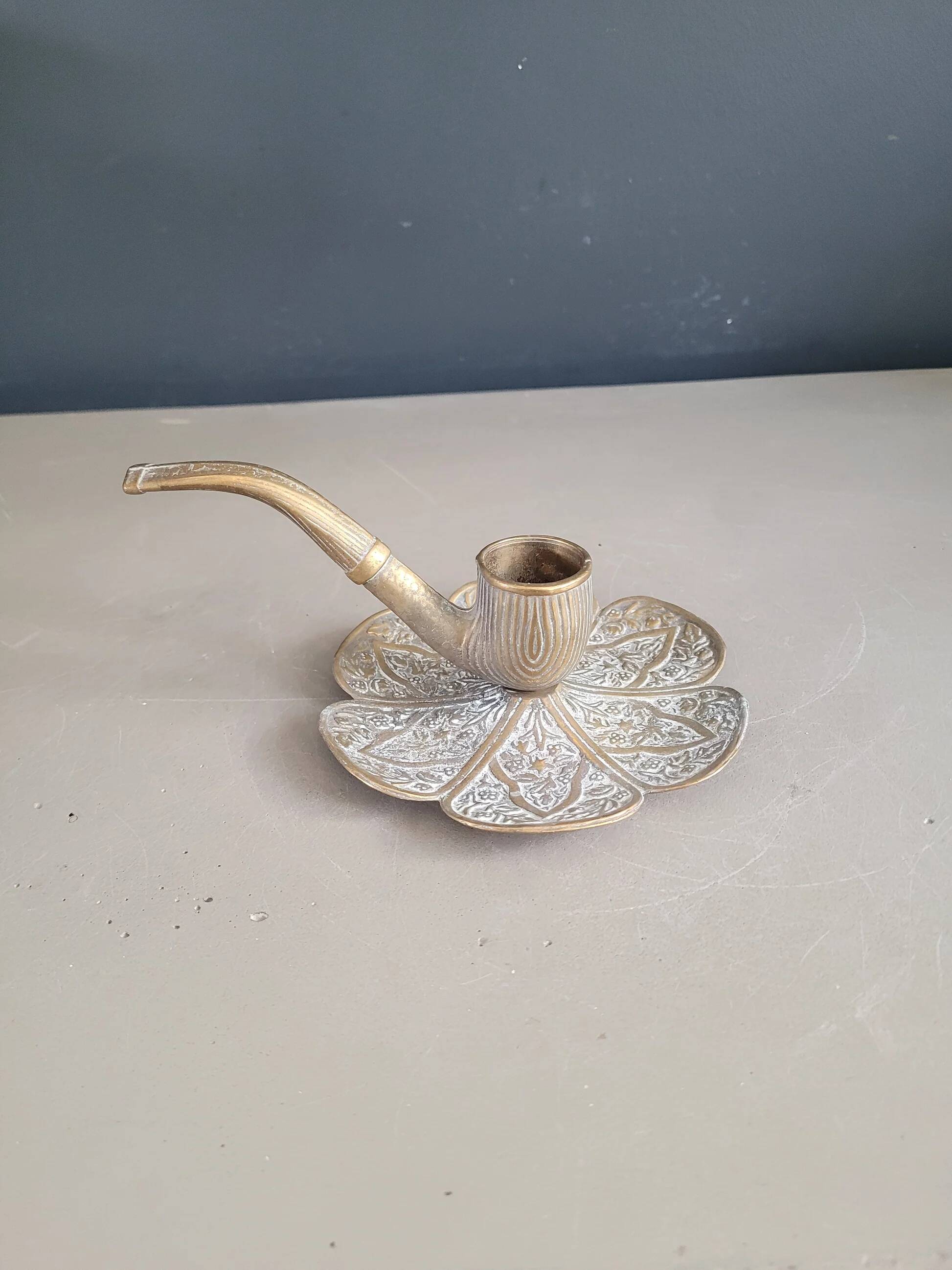 Ornate brass pipe candlestick