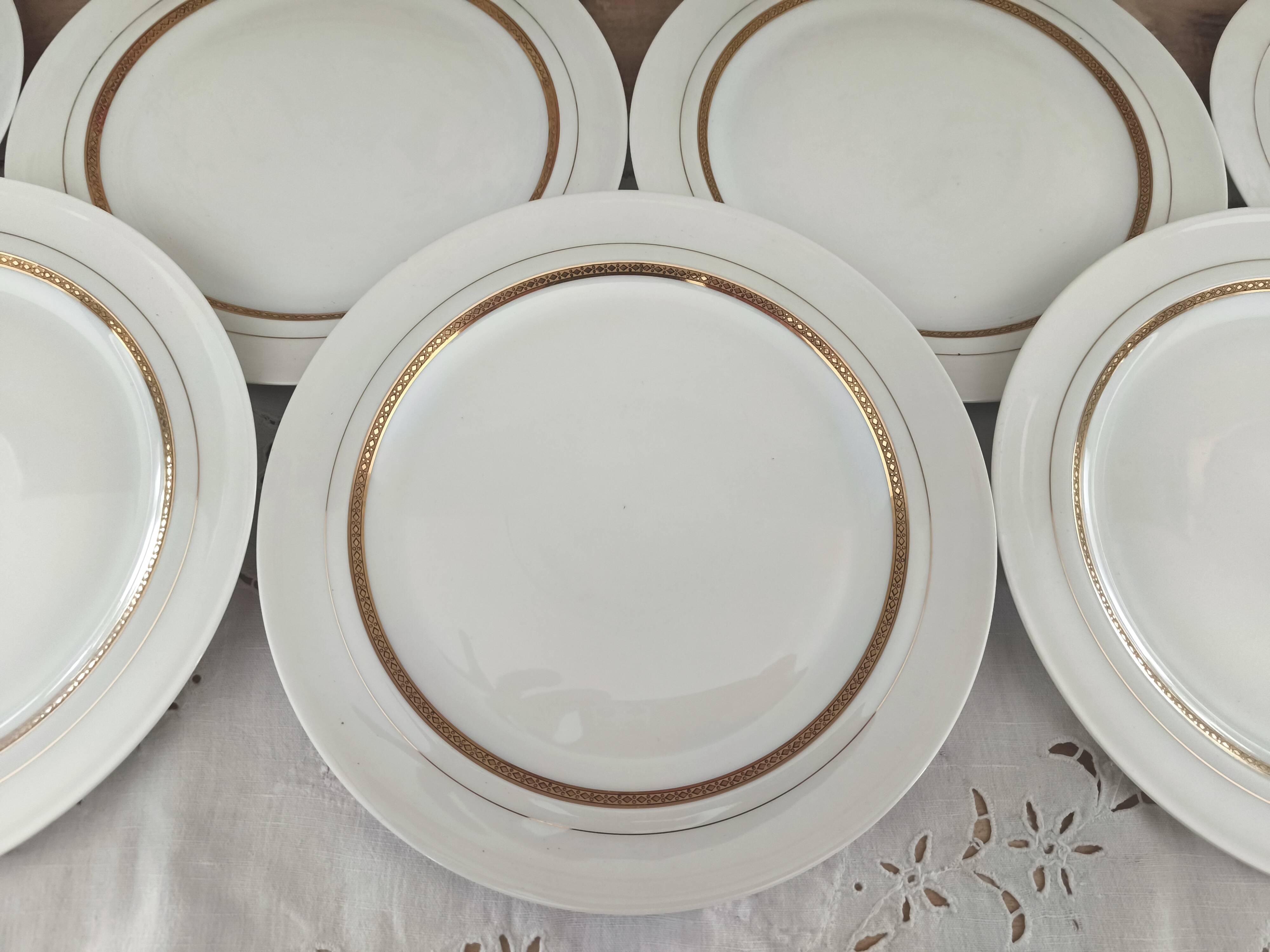 Set of 7 Limoges porcelain dinner plates by A. Vignaud