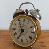 Vintage brown and silver mechanical alarm clock