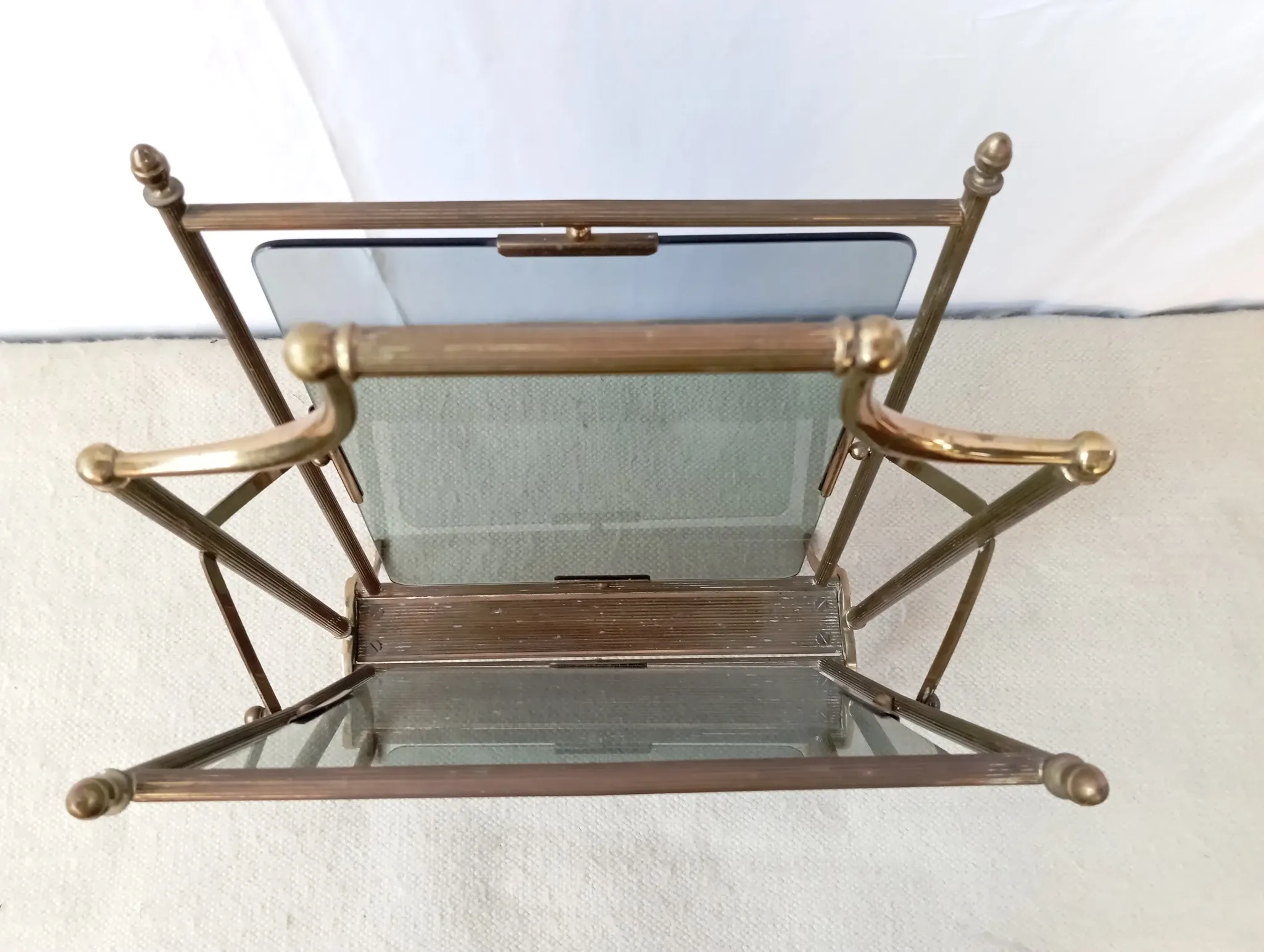 Neo-classical brass magazine rack in the spirit of Maison Jansen.