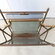 Neo-classical brass magazine rack in the spirit of Maison Jansen.