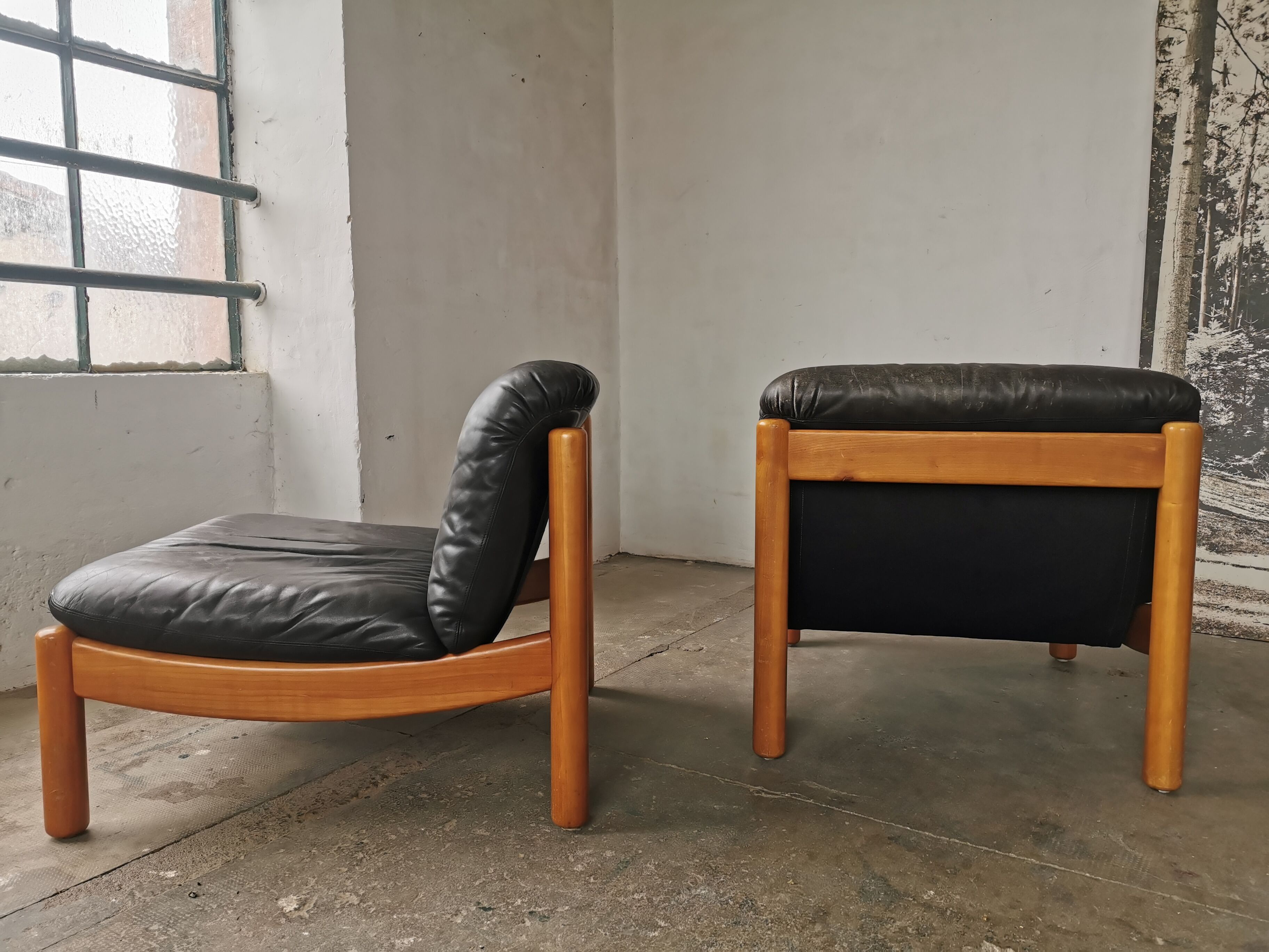 Pair of designer leather armchairs 80s