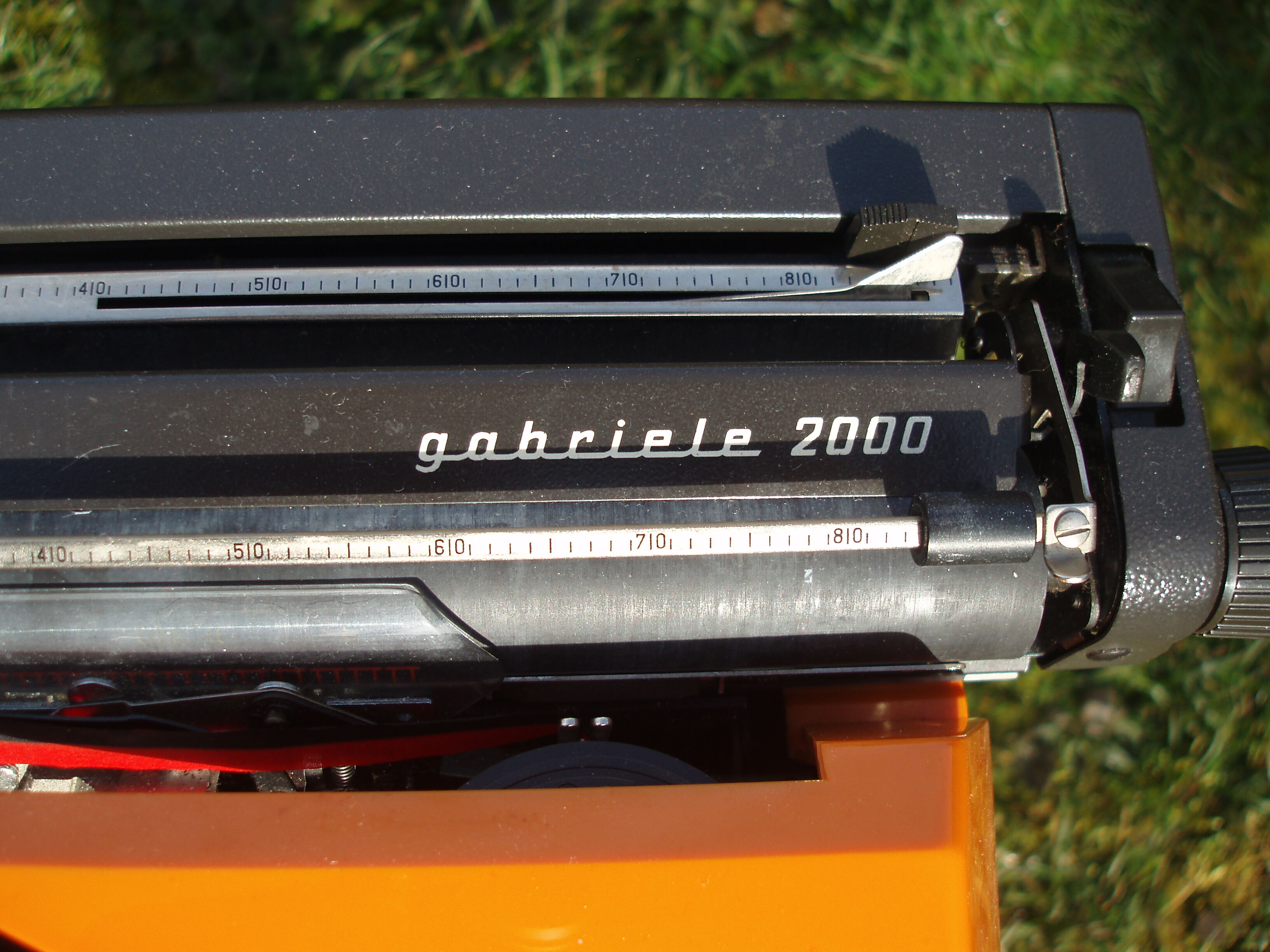 Electric writing machine adler orange and black with its suitcase