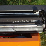 Electric writing machine adler orange and black with its suitcase