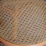 Beautiful caned stool in curved blond wood. 1940s/1950s