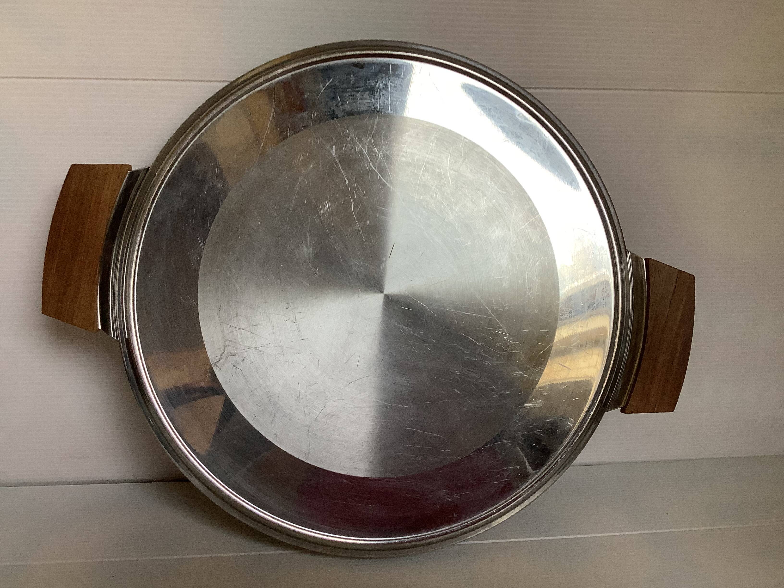 Large flat metal and wood platter in Scandinavian style.