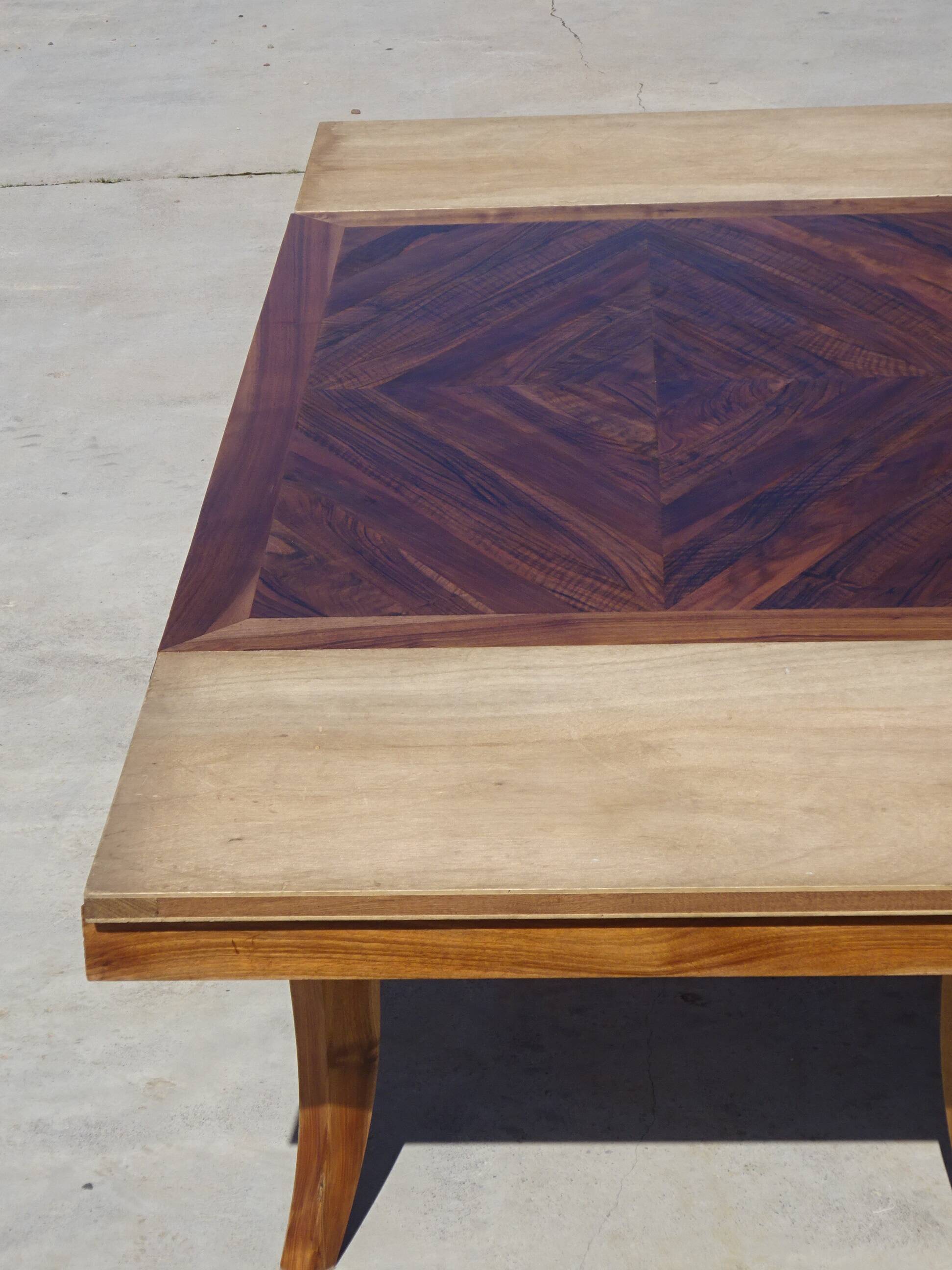 Antique solid walnut table with marquetry and extensions.