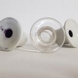 Three white porcelain and glass inkwells for school desk
