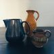 Stoneware pitcher with striped decoration