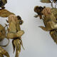 Pair of gilded metal sconces decorated with flowers and foliage. Year 60