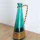 Vase in green glass and lanyards 70s doilies