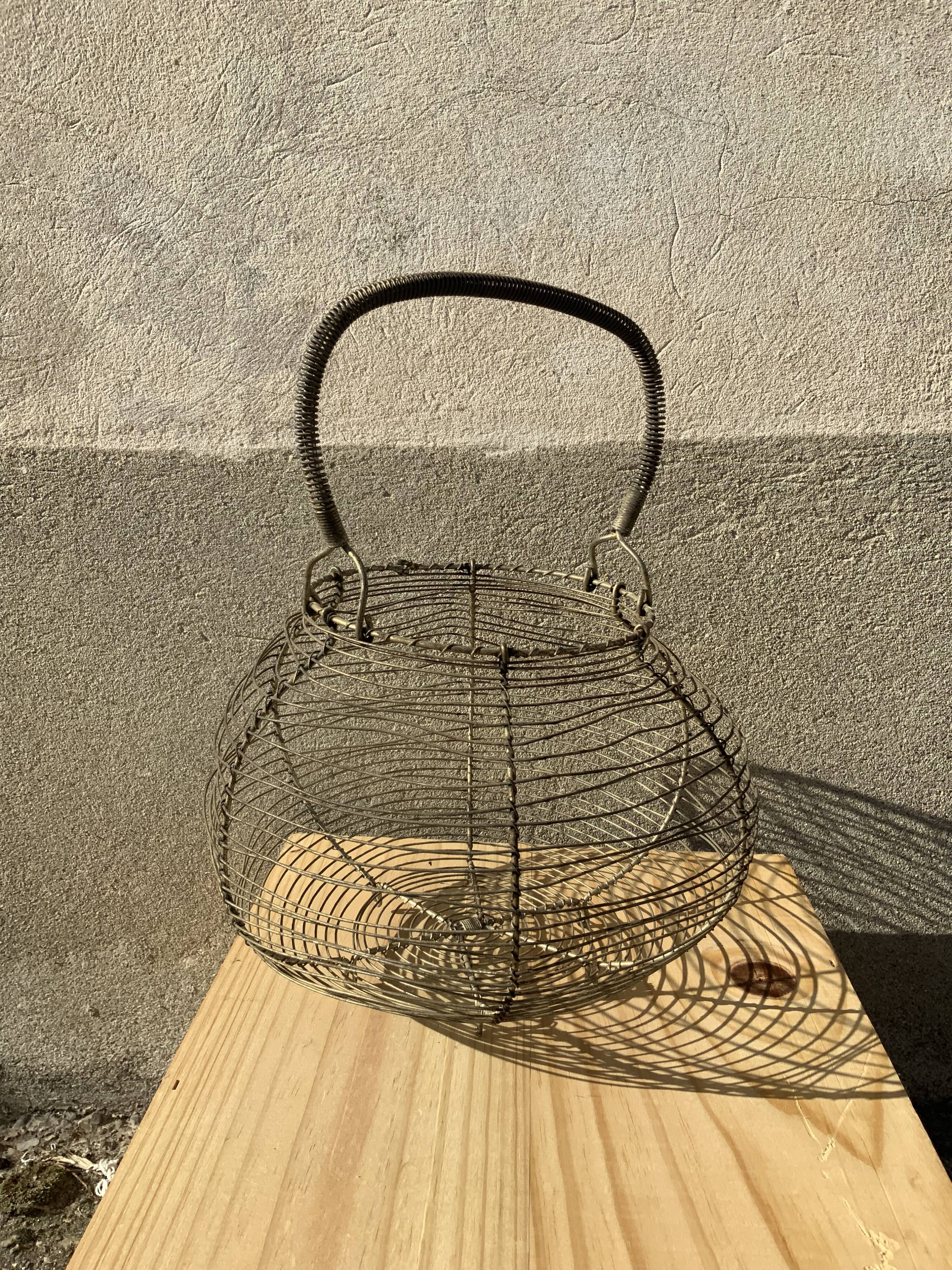 Vintage iron egg basket with hanse antique