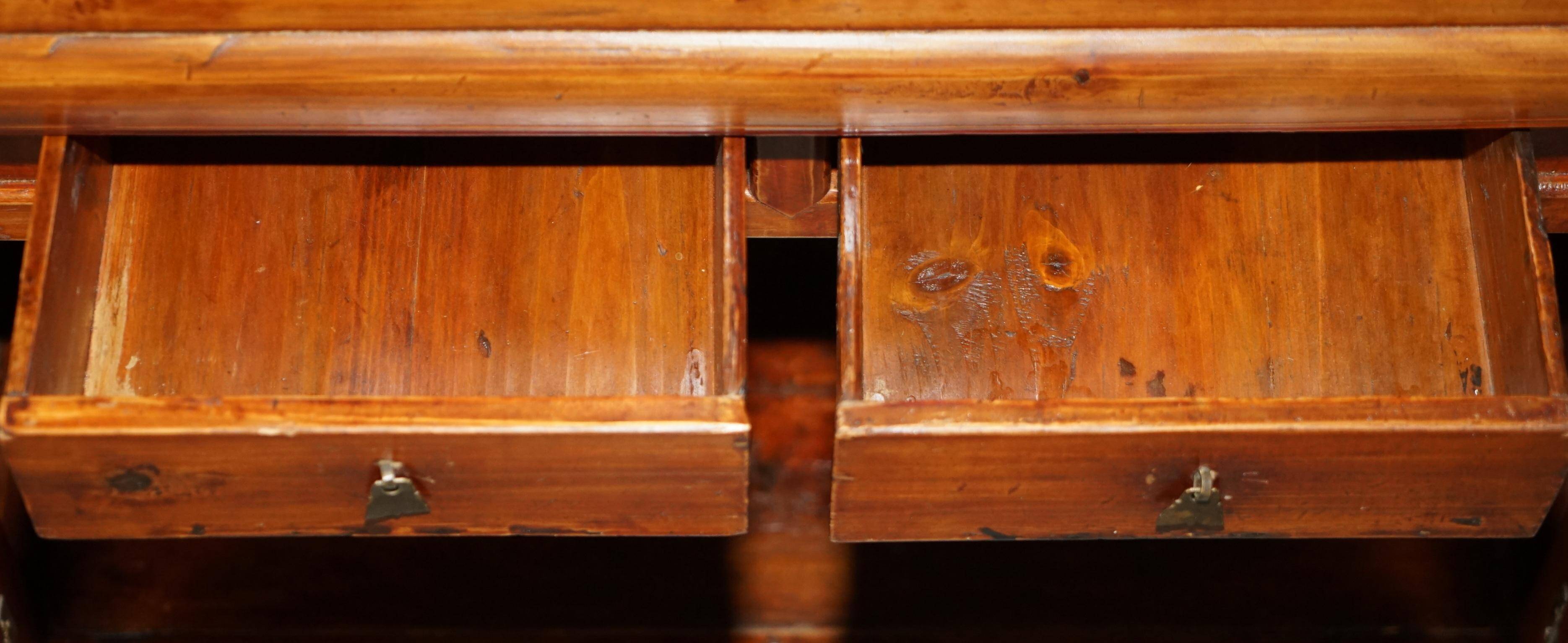 Antique Chinese armoire hand-carved around 1880 with country-style handles.