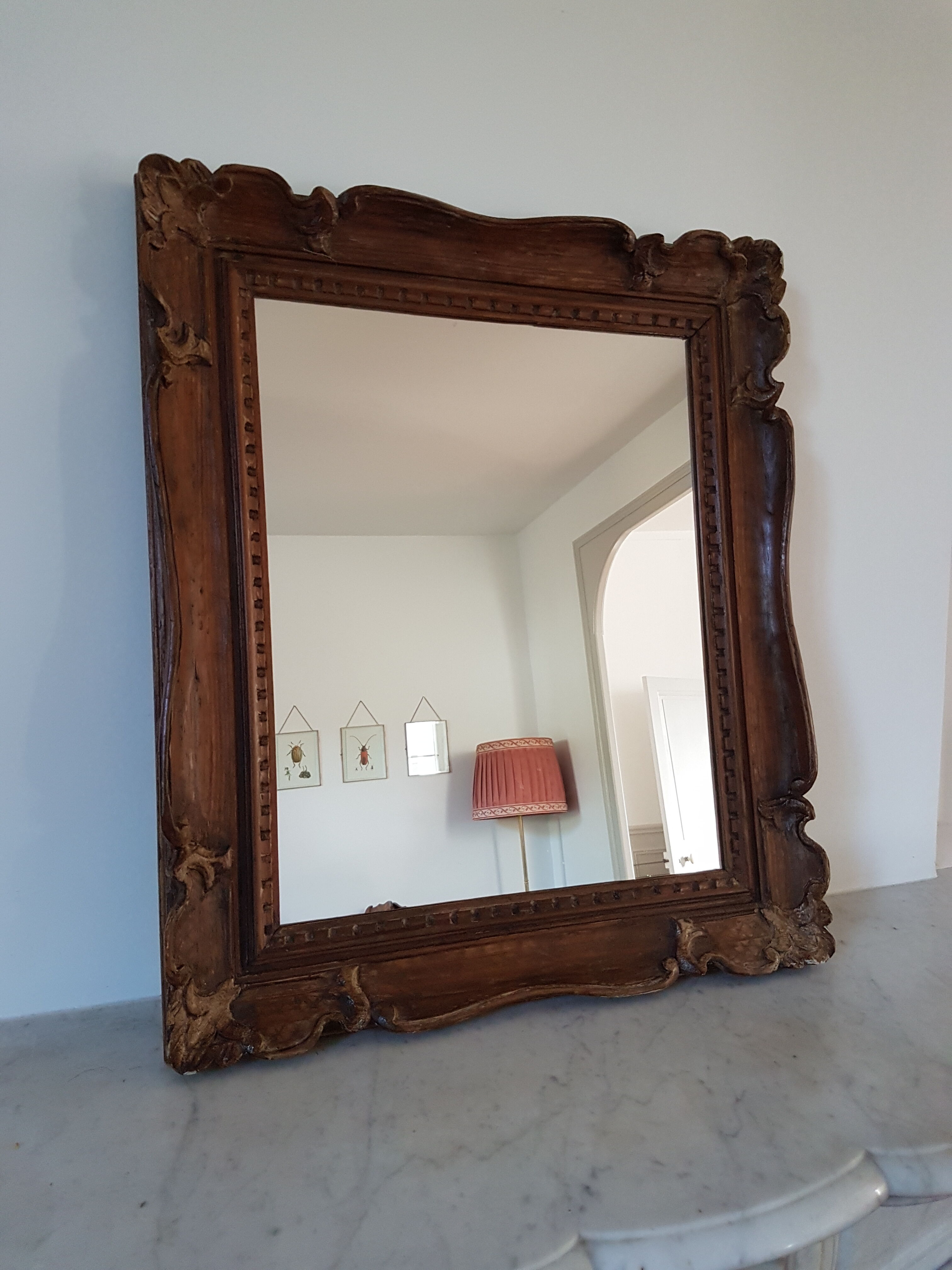 Carved wooden mirror