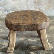 Small stool, oval solid teak side table with curved legs in wabi-sabi style.
