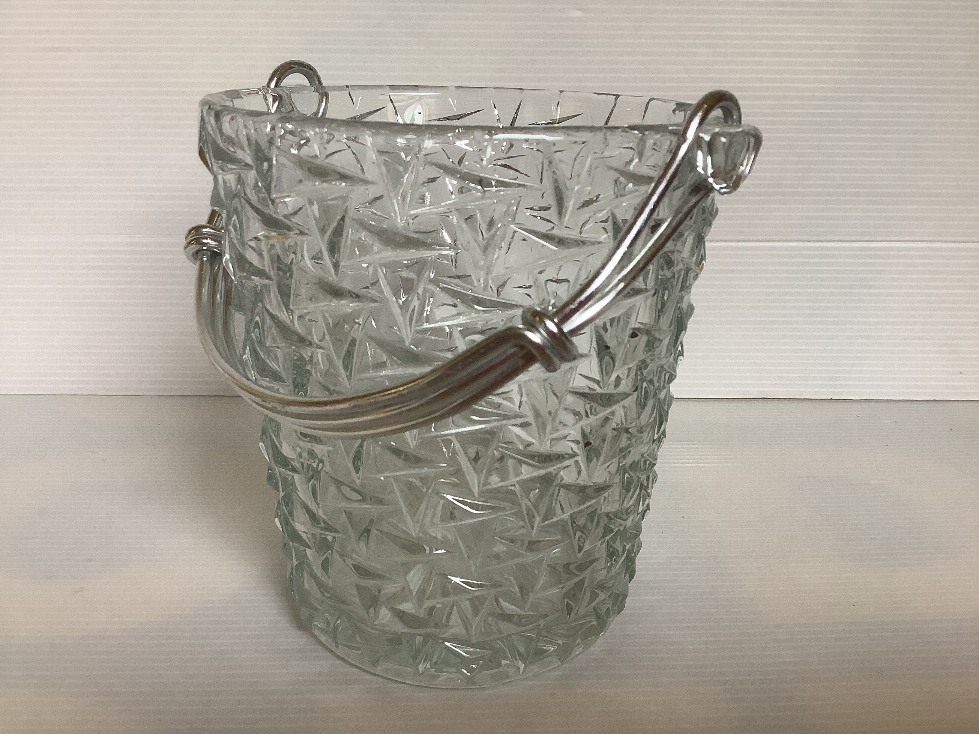 Geometric triangle patterned ice bucket in glass.