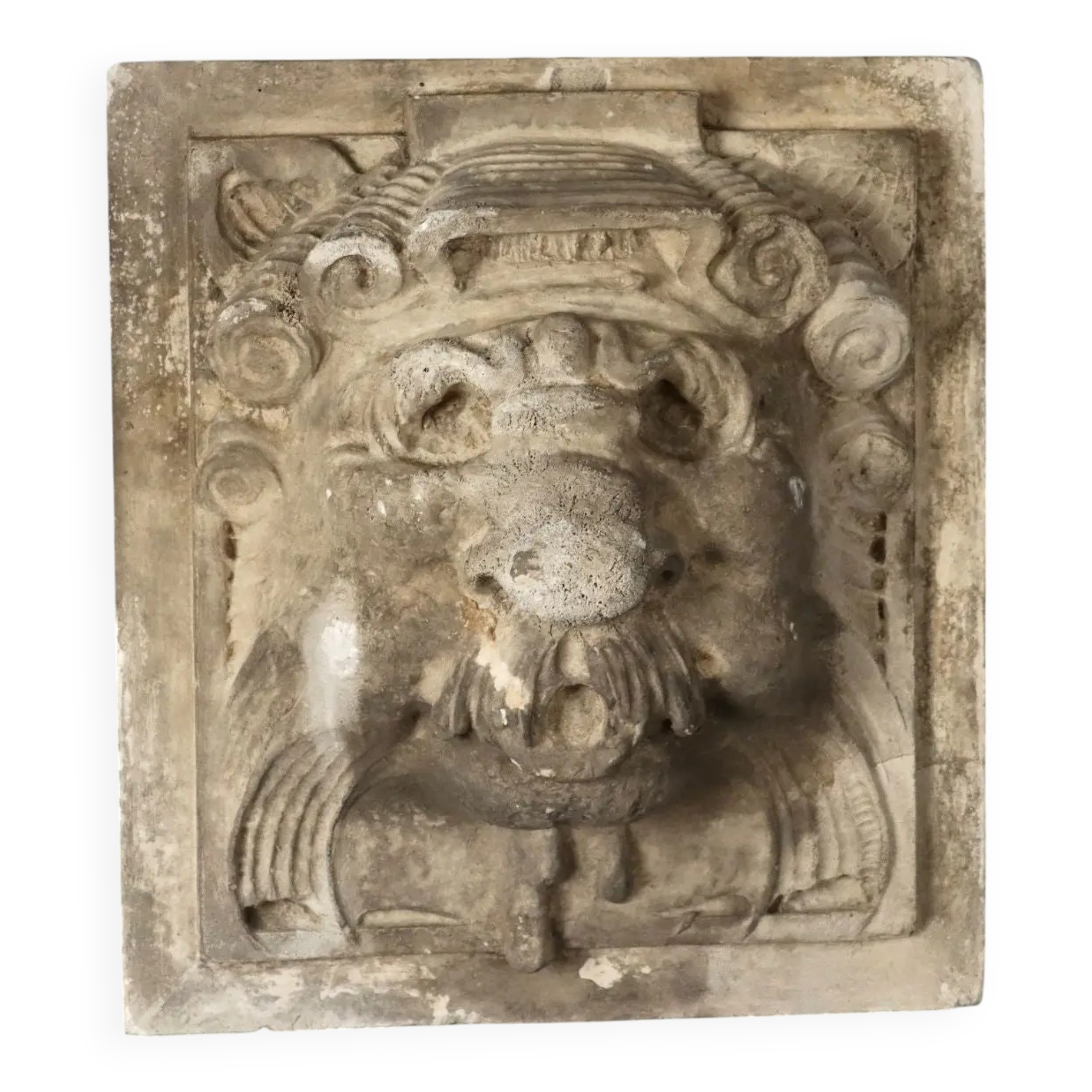Old plaster tile with a fierce mask decoration, Italy, 19th century.