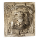 Old plaster tile with a fierce mask decoration, Italy, 19th century.