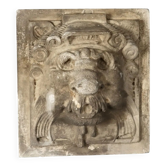 Old plaster tile with a fierce mask decoration, Italy, 19th century.