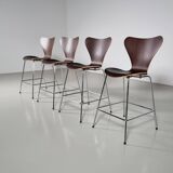Set of 4 brown oak plywood bar stools by Fritz Hansen Series 7 by Arne Jacobsen.
