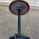 Round bistro table with a central pedestal, gold marble effect and black steel, 60cm.