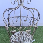 Decorative bird cage with iron hearts