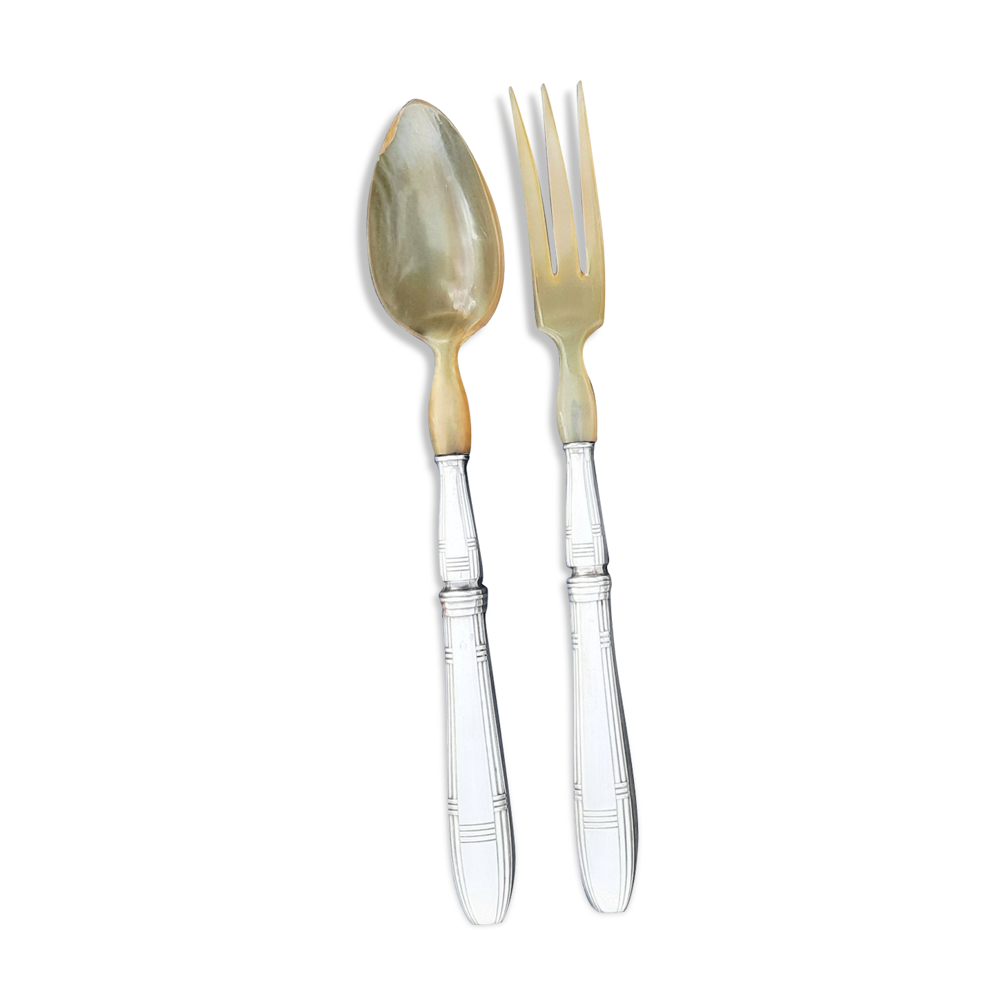 Corn and silver metal salad cutlery