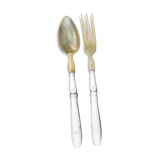 Corn and silver metal salad cutlery