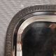 Silver-plated service tray with handles, neoclassical decoration.