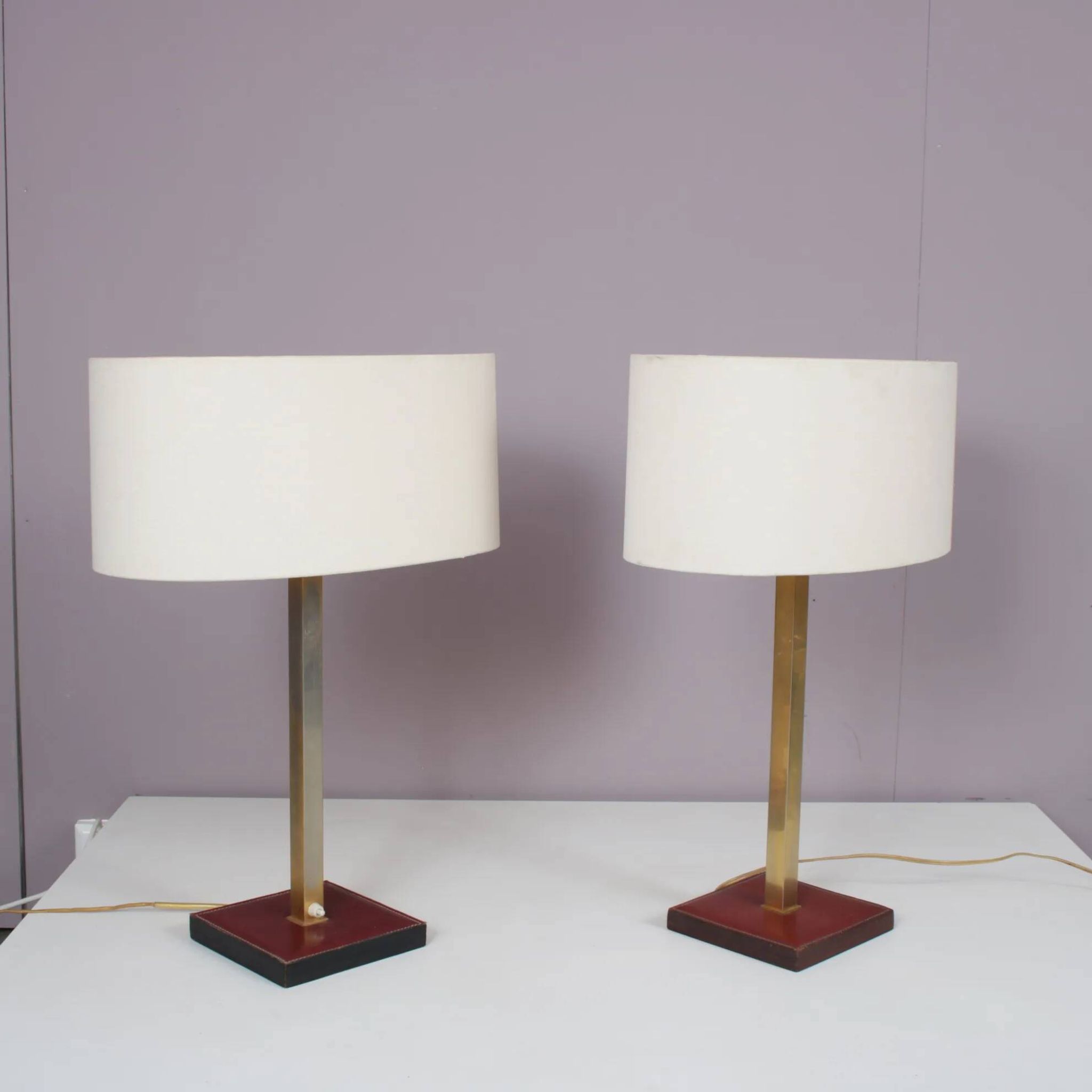 Pair of leather and brass table lamps from the 1960s, originating from Belgium.