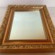Gilded wooden beaded mirror
