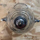 Old glass and metal liquid soap dispenser