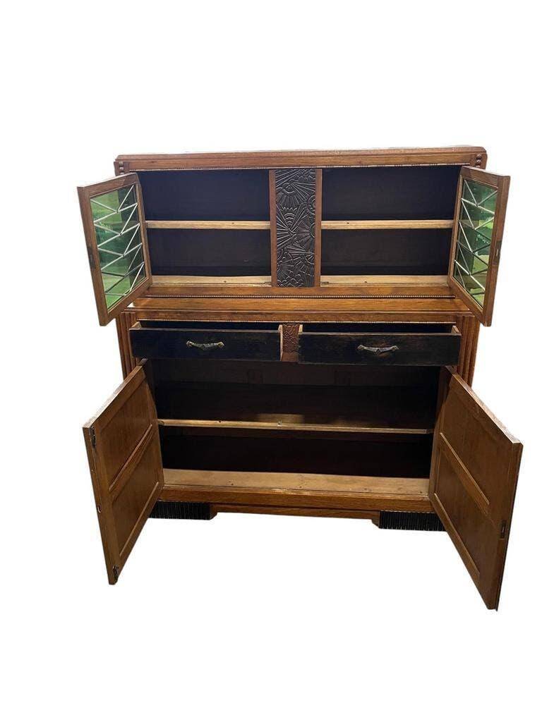 Vintage Art Deco display cabinet in wood with green stained glass.